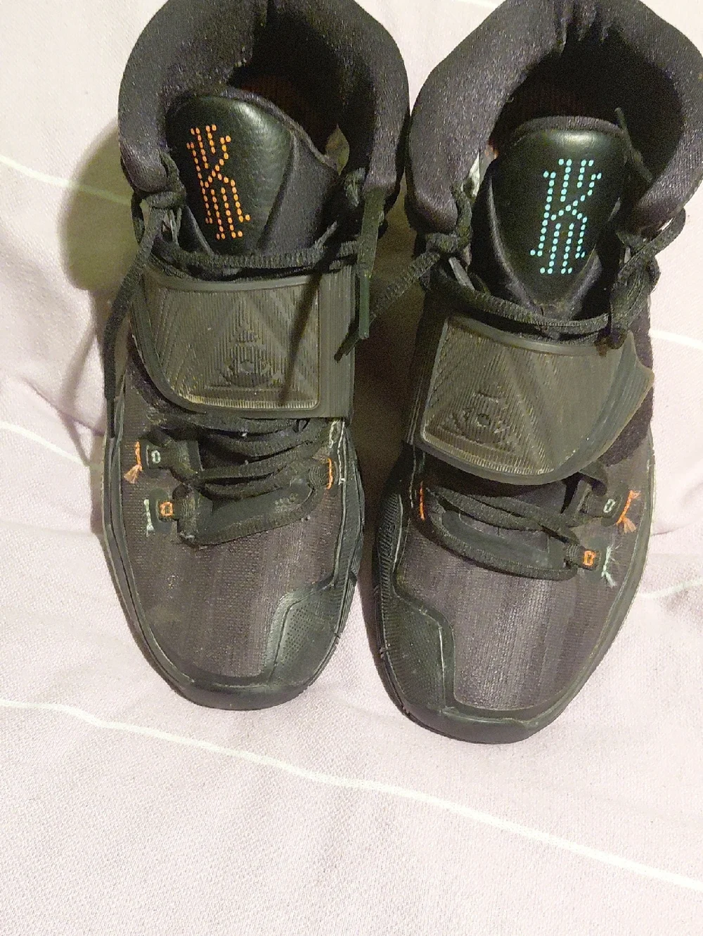 Nike Men's Black Athletic Shoes with Teal and Orange Accents